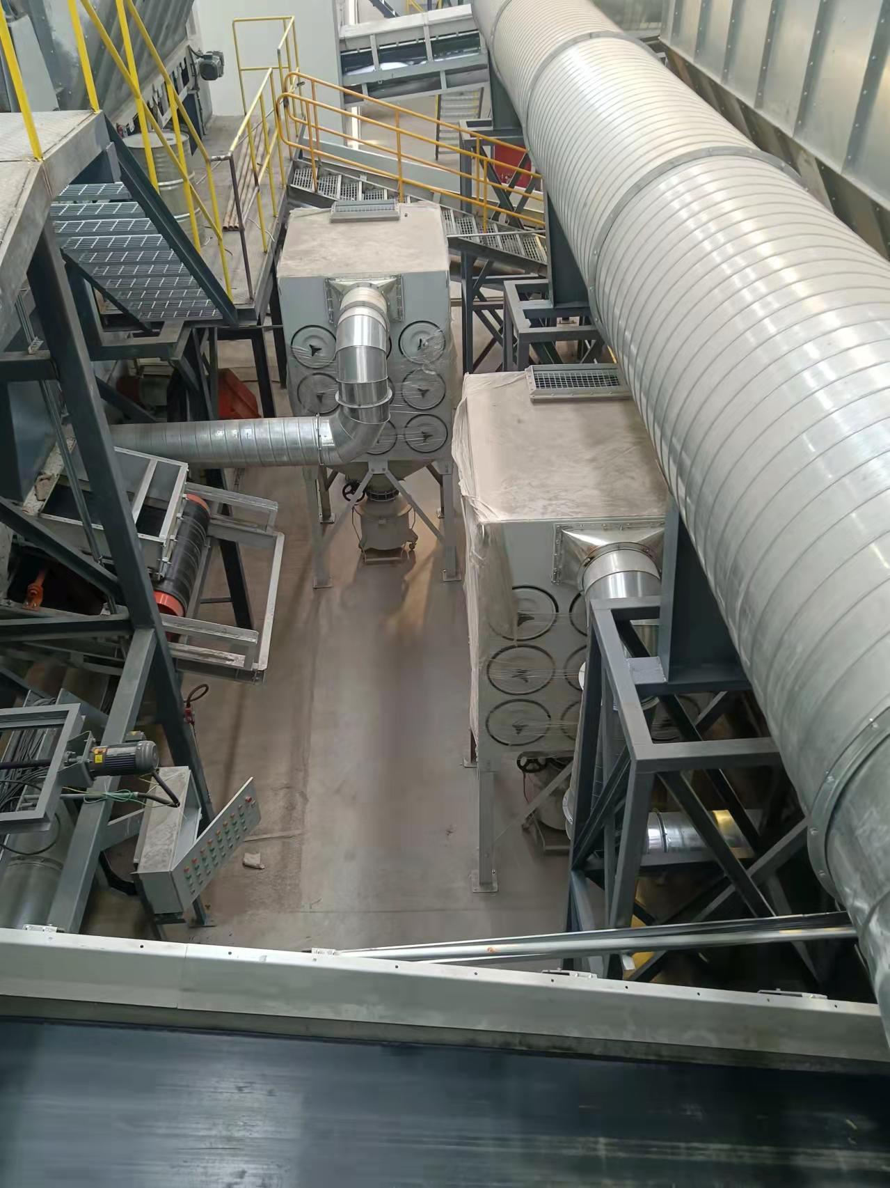 Large-scale baghouse and cartridge dust collector systems at Quzhou waste sorting and crushing facility, achieving energy-efficient and compliant dust control.